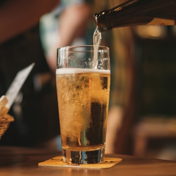 A five-pour tasting flight on a wooden paddle